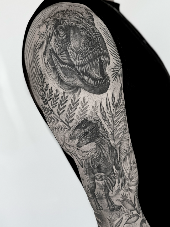 dinosaur tattoo on arm