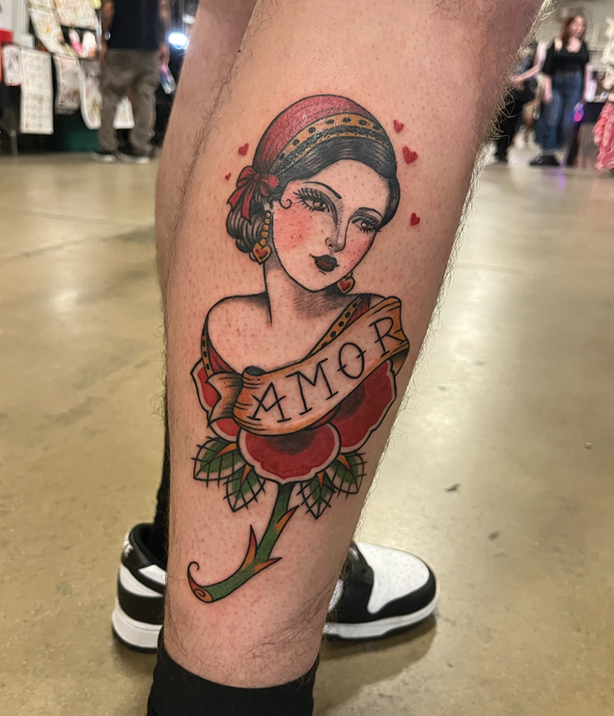 female portrait tattoo on leg