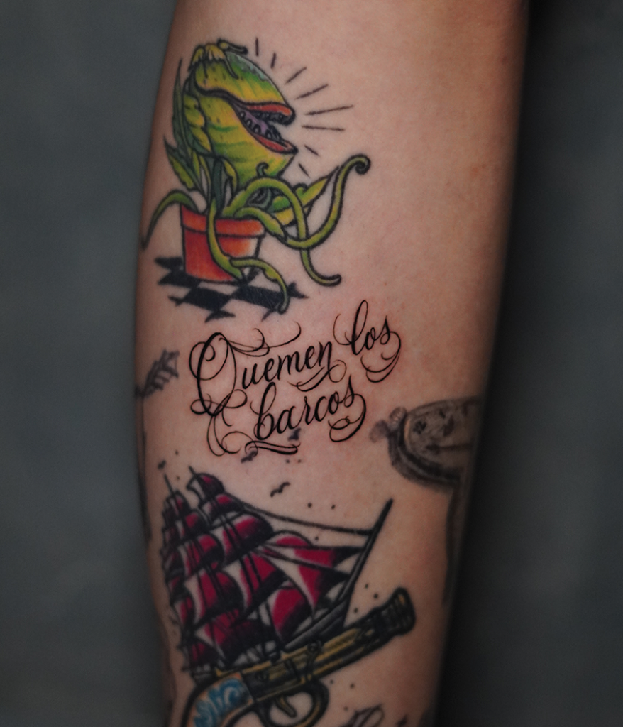 script tattoo on arm