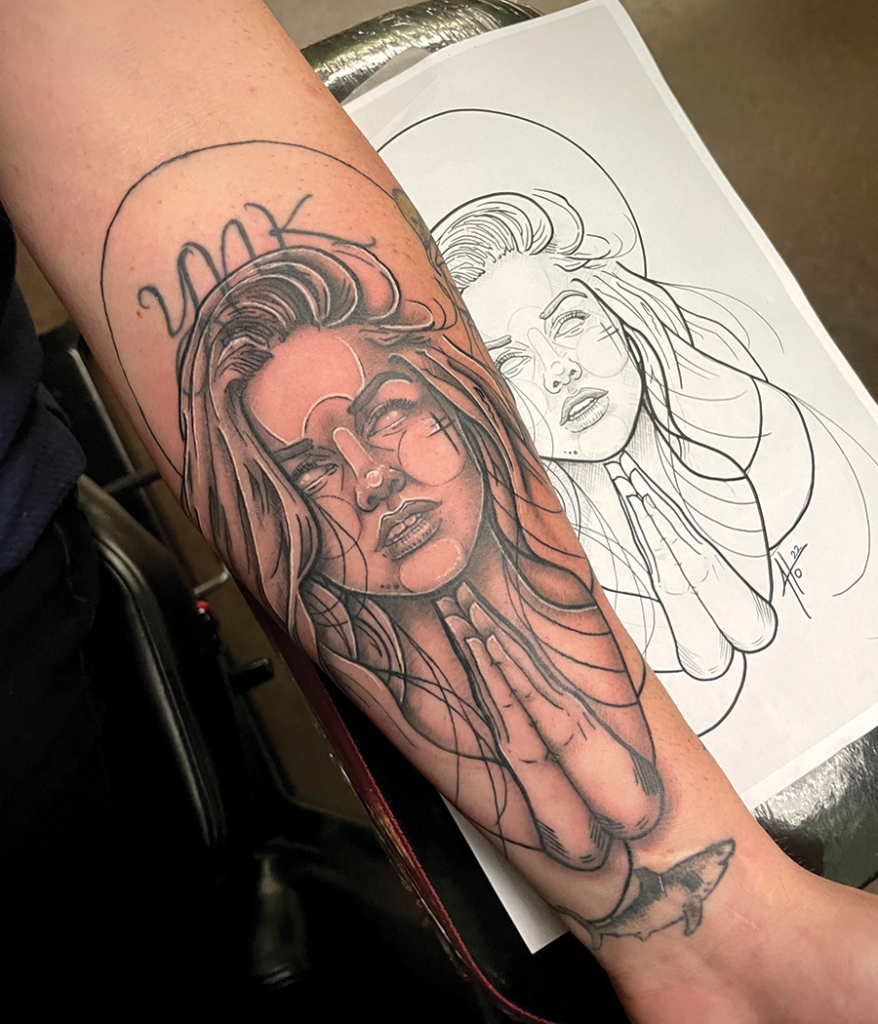 praying portrait tattoo on arm