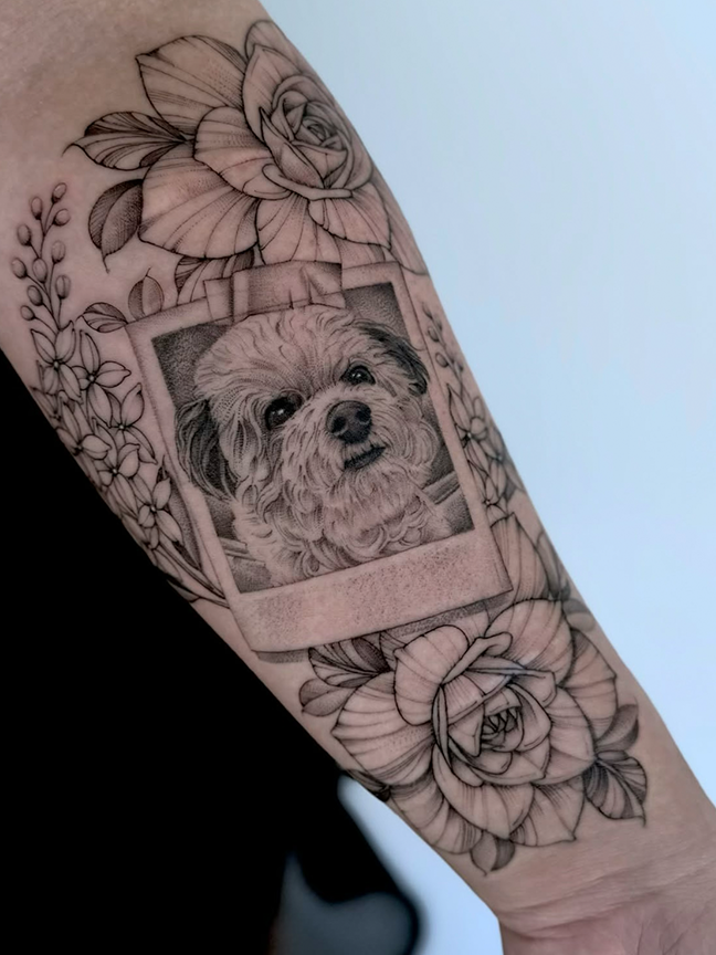 polaroid portrait tattoo of a dog on arm
