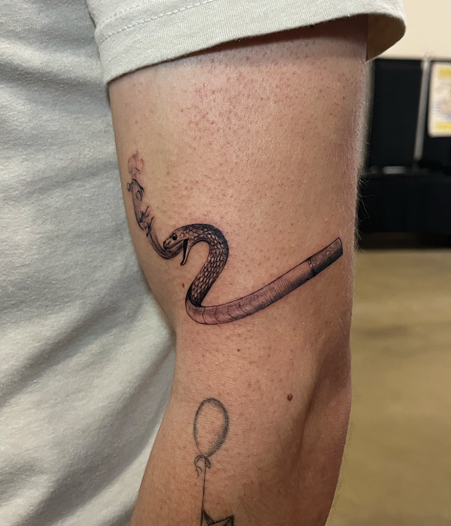 Snake tattoo on leg