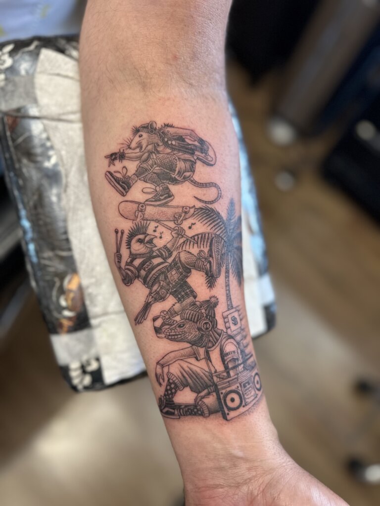 cartoon animals tattoo on arm