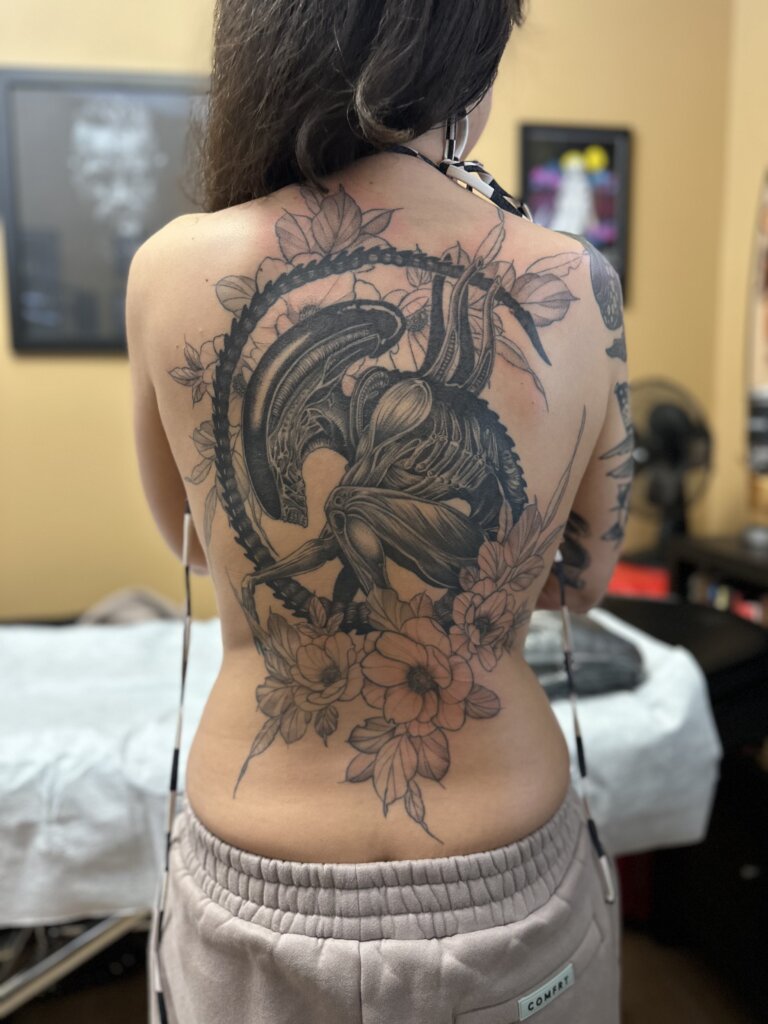 alien tattoo on back