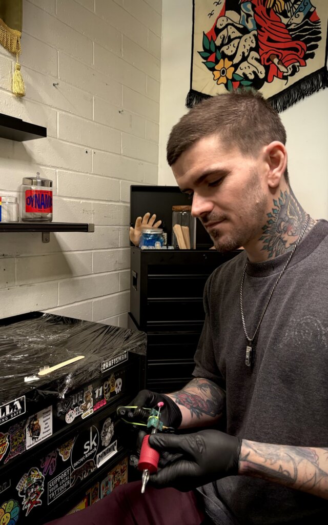 Tattoo artist in studio