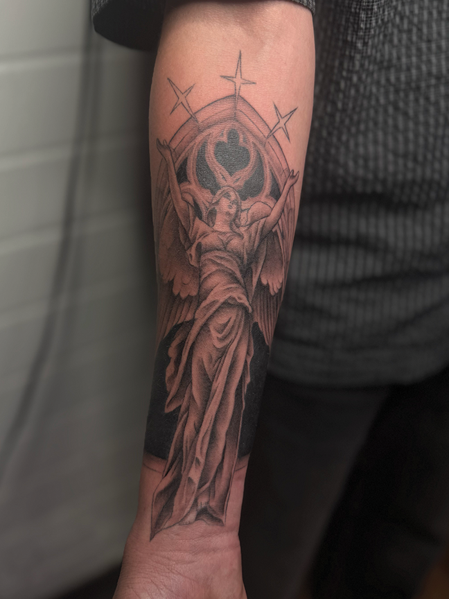 religious tattoo on arm