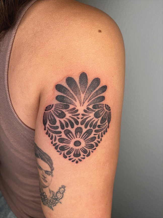 Mandala flower tattoo on arm