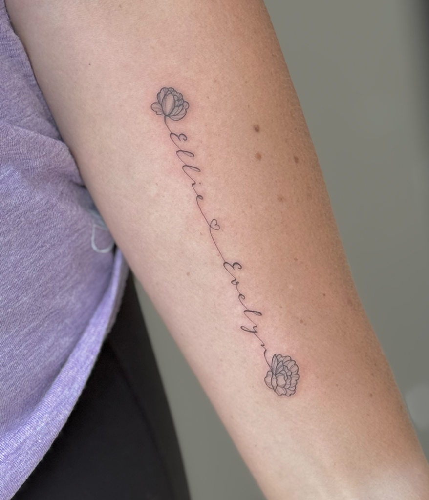 script tattoo on arm