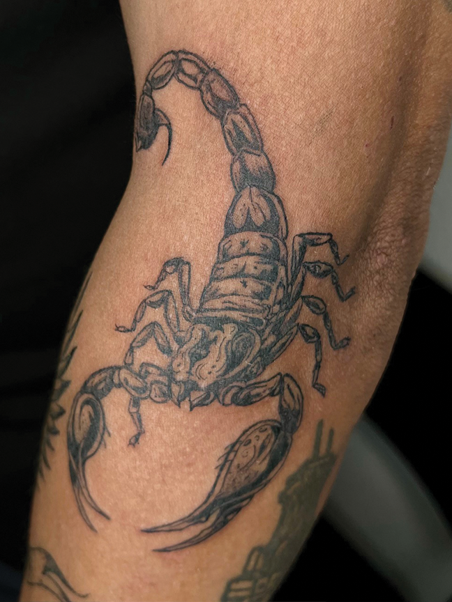 Scorpion tattoo on arm