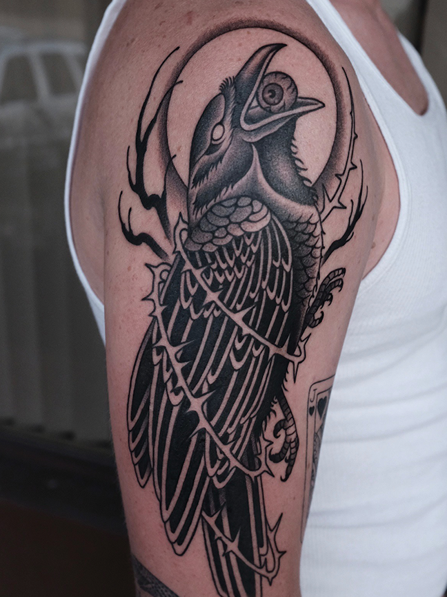 crow tattoo on arm