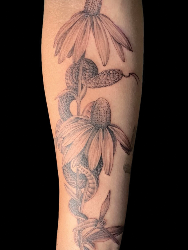 stenciled flowers tattoo on arm