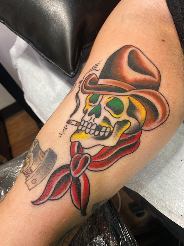 skull smoking tattoo on arm