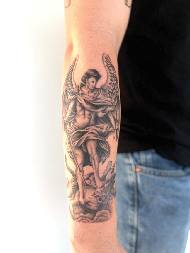 angel tattoo on arm