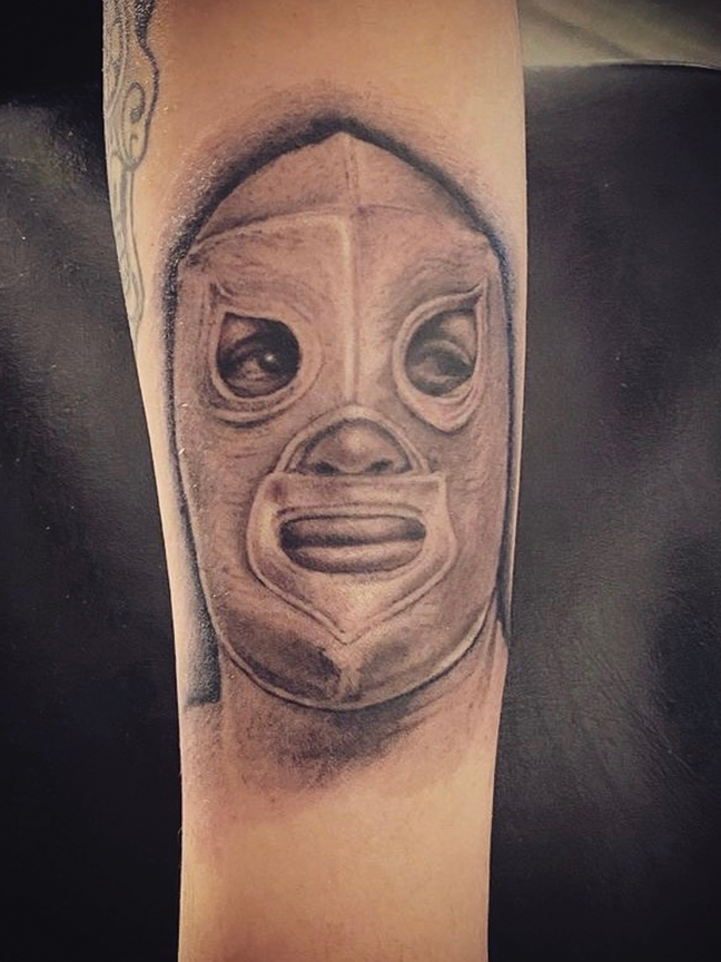 luce libre mask tattoo on arm