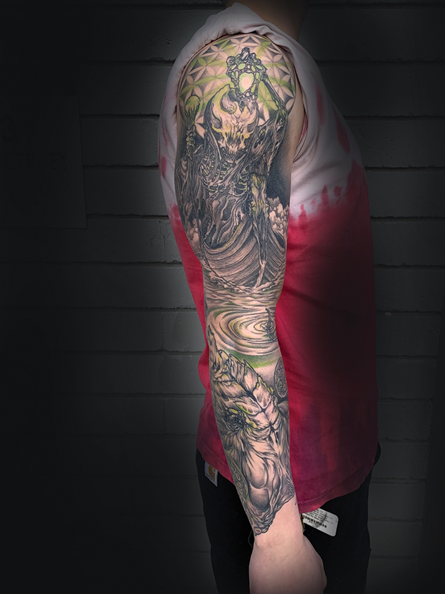 Full sleeve tattoo on arm