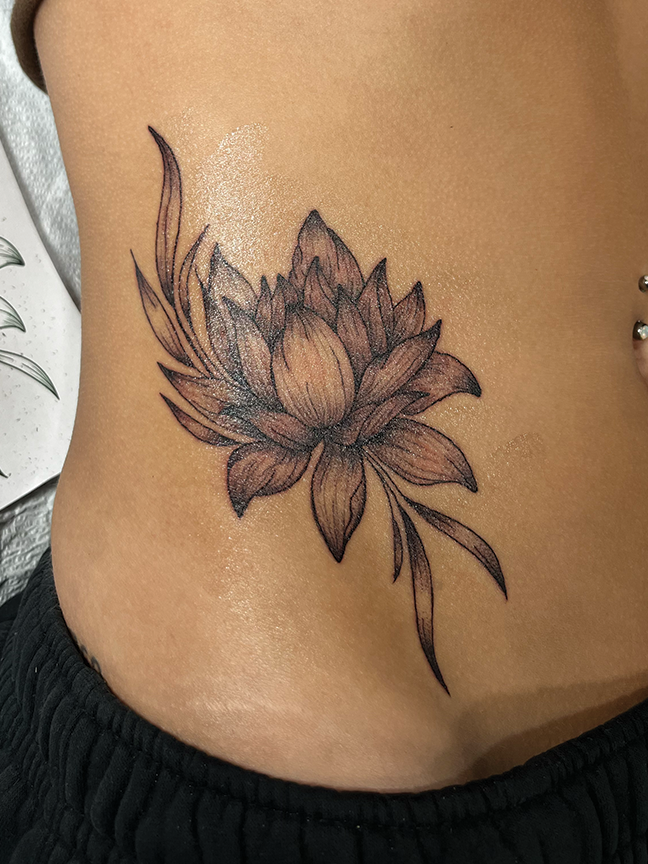 lotus flower tattoo on hip