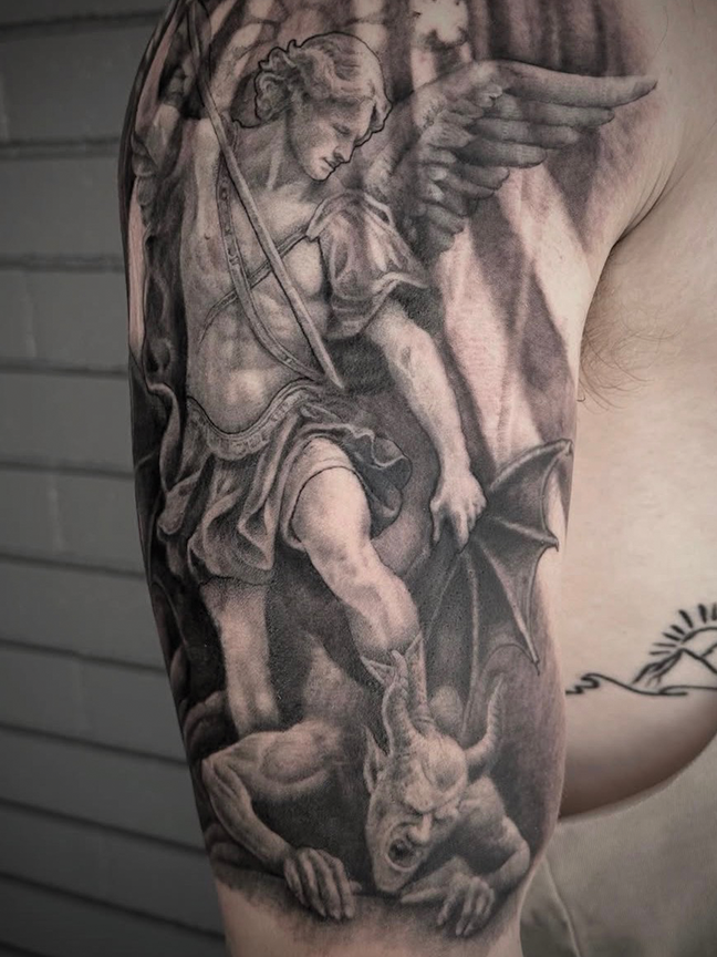 religious scene tattoo on arm