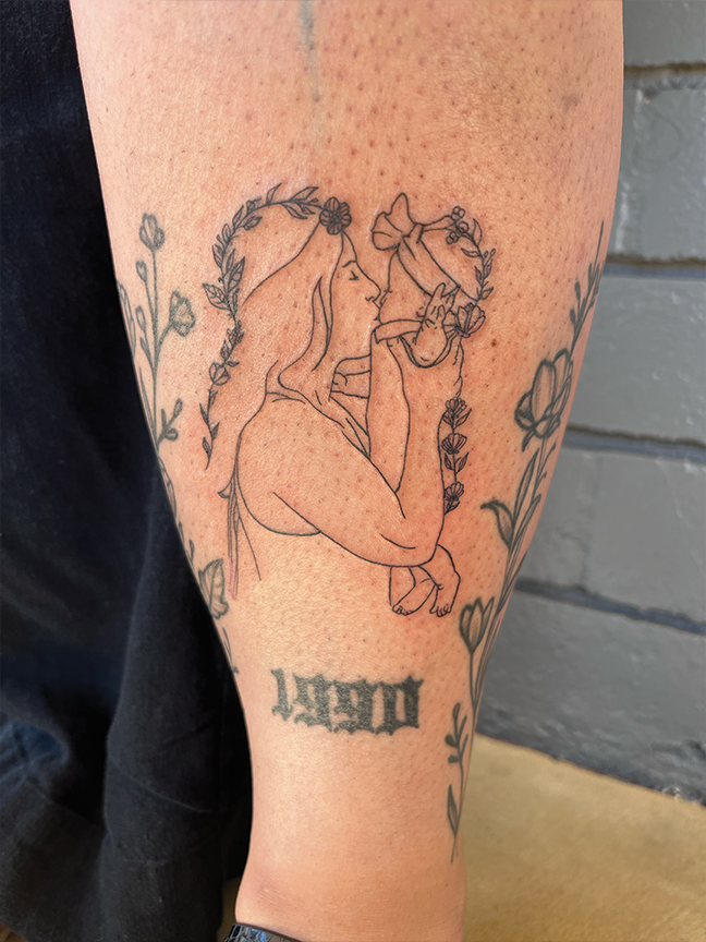 outline female portrait tattoo on thigh