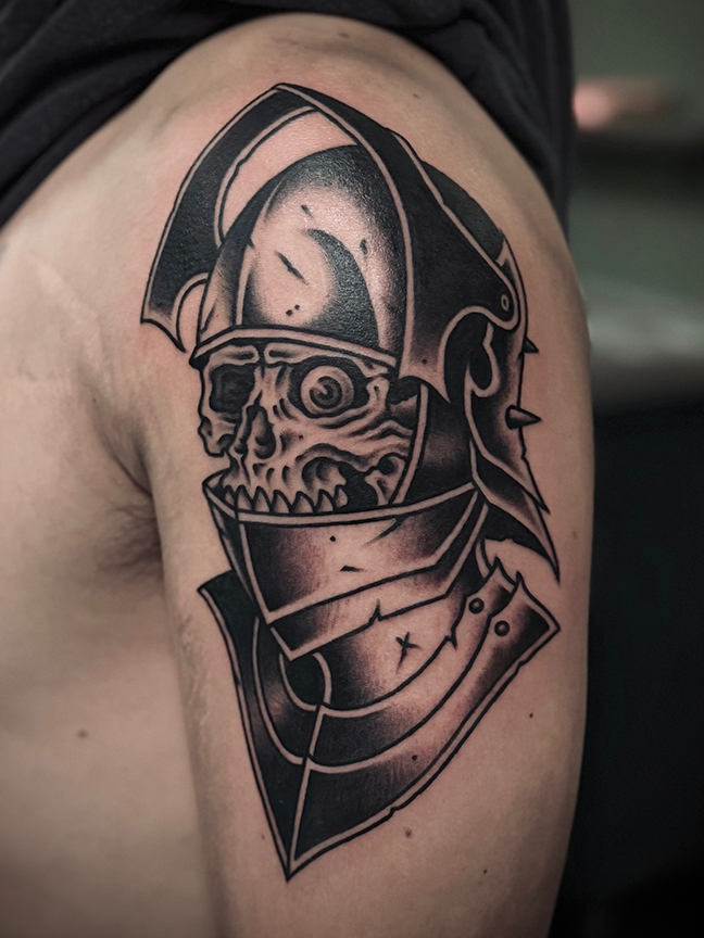 skeleton in armor tattoo on shoulder