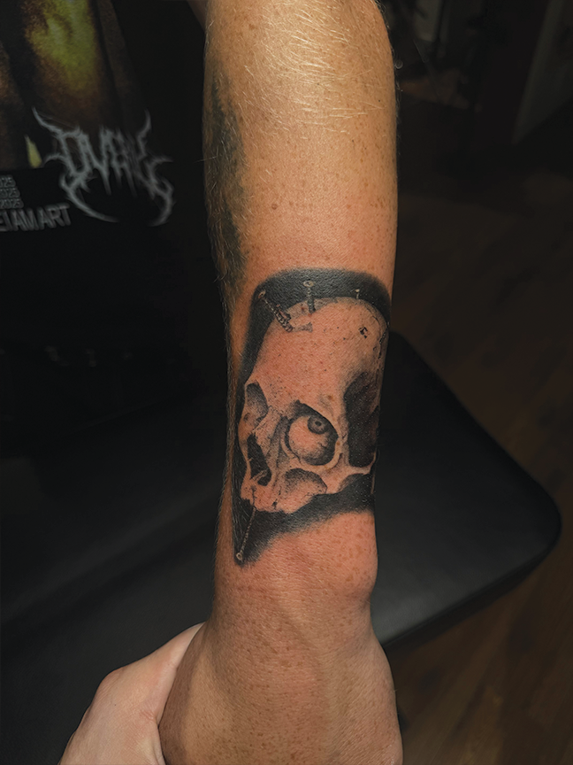 scull tattoo on arm
