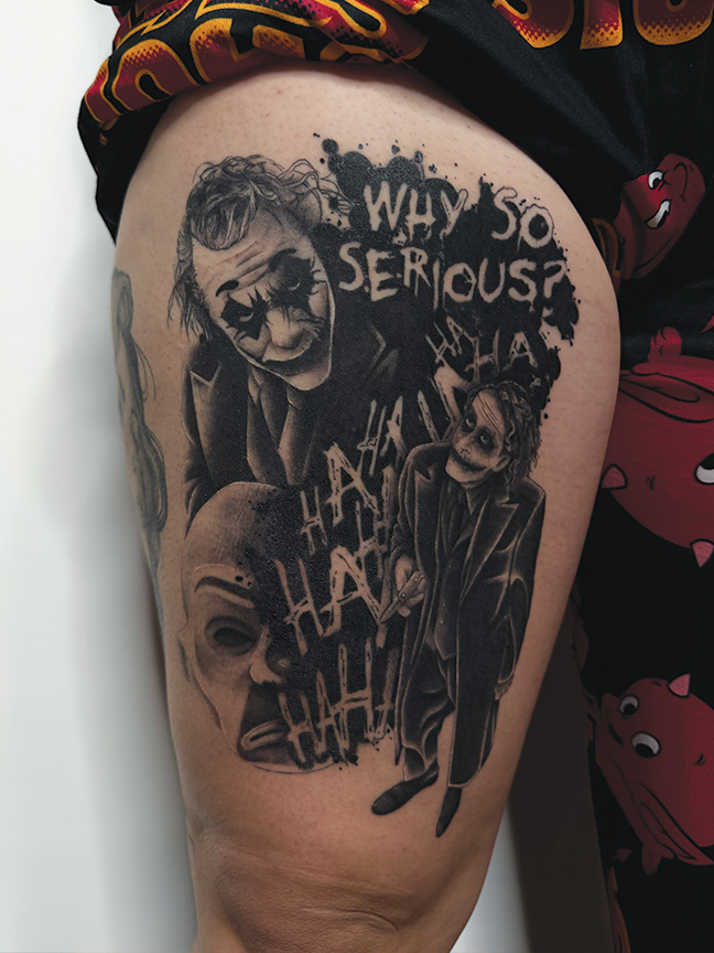joker theme tattoo on leg
