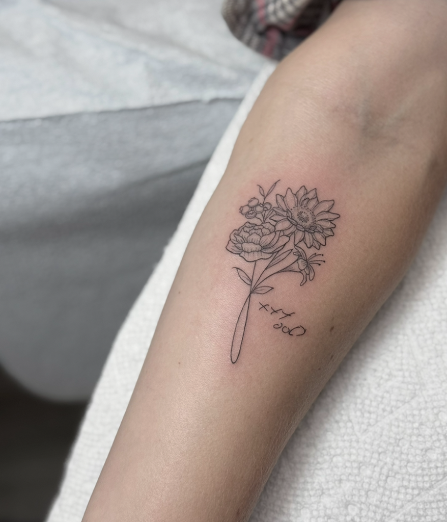 flower tattoo on inner arm