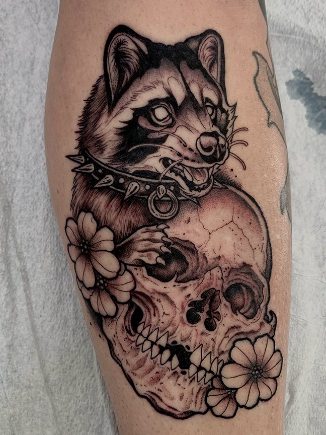 raccoon and skull tattoo on leg
