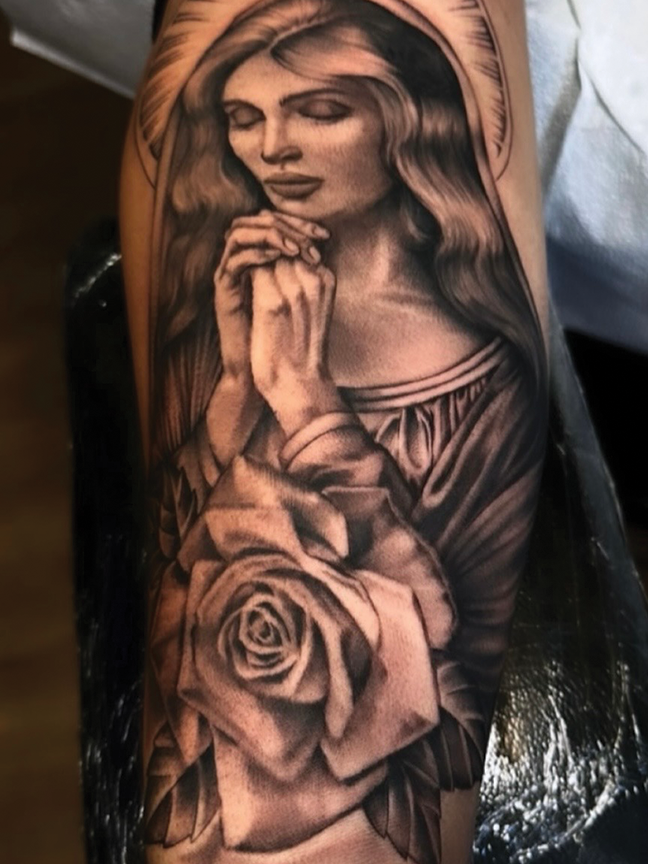 female praying portrait tattoo