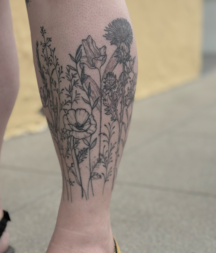 wildflower tattoo on leg