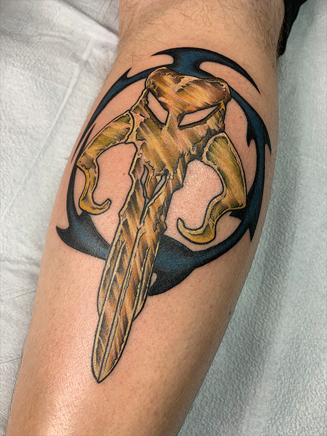 Ornamental design tattoo on arm