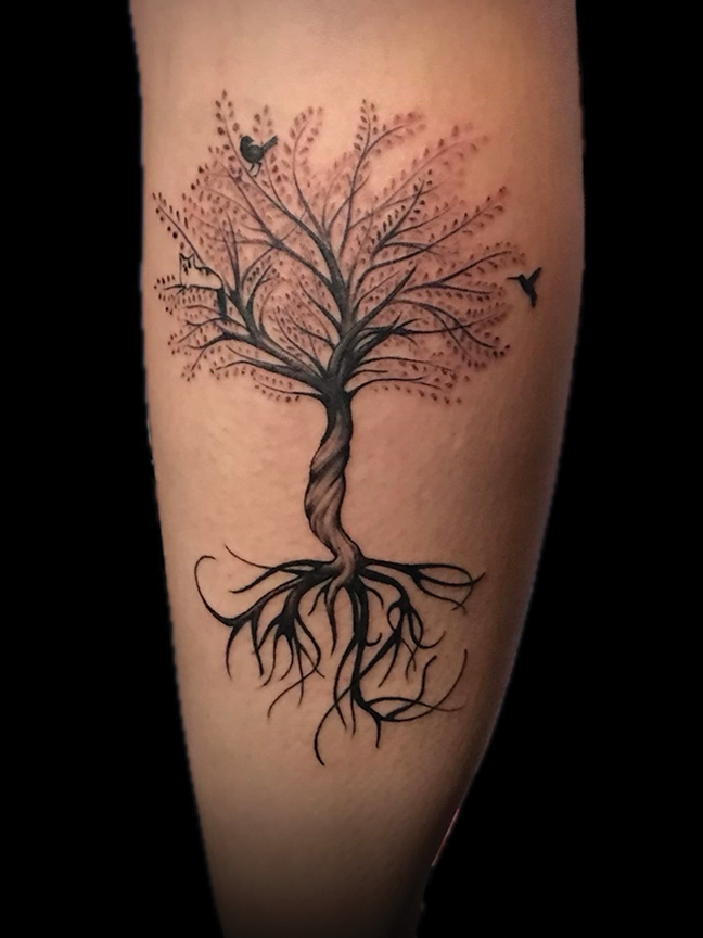tree and roots tattoo on leg