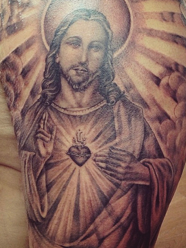 jesus tattoo on leg