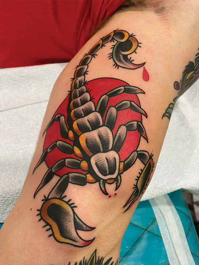 scorpion tattoo on leg