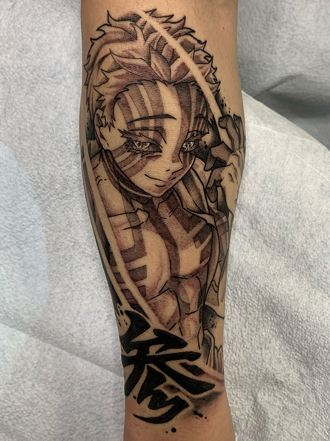 anime character tattoo on leg